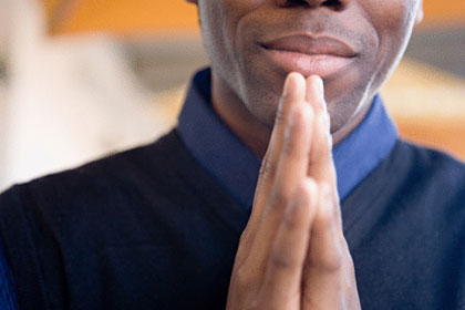 praying black man