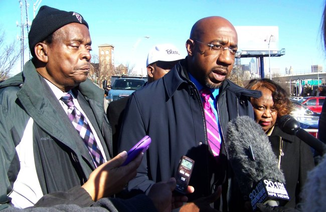 Rev. Dr. R.L. White (left) and Rev. Dr. Raphael Warnock (right) take questions from reporters