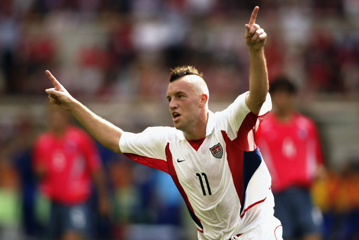 Clint Mathis of the USA celebrates scoring the opening goal