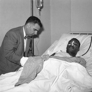 MLK recovering in the hospital following the near-fatal stabbing. 