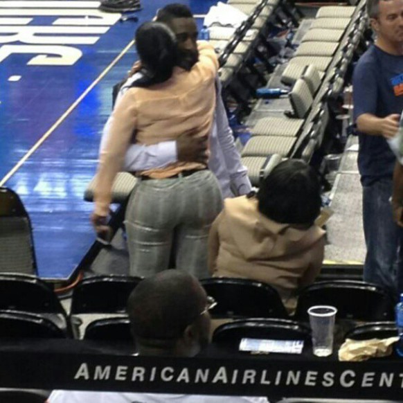 Rapper Trina hugging James Harden prior to a recent NBA game.  