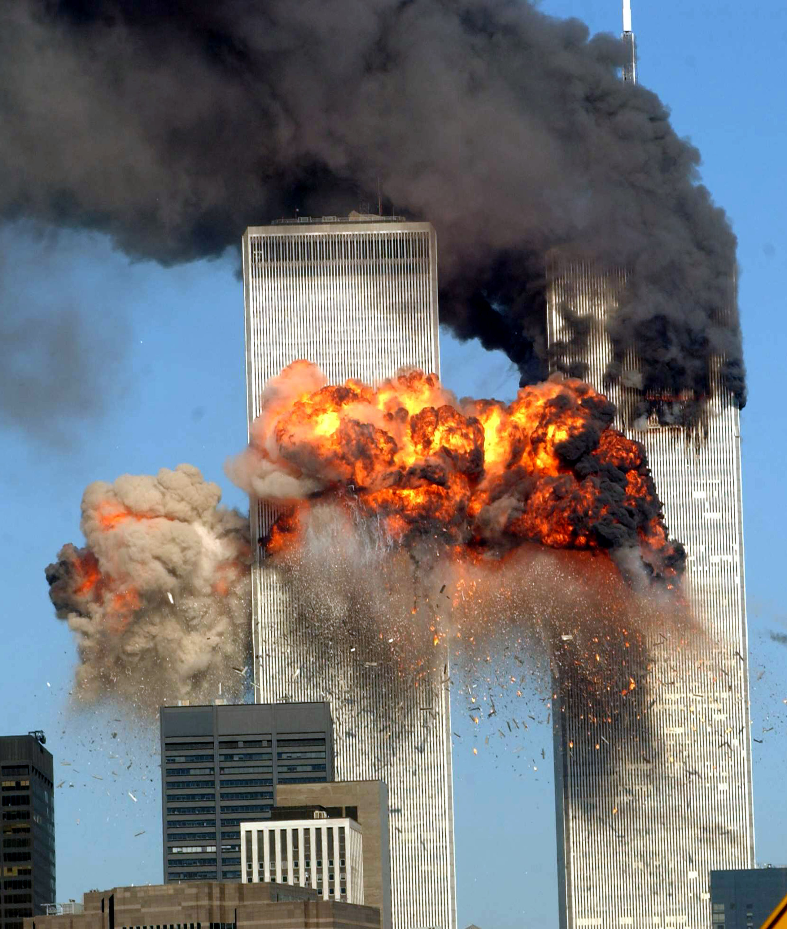 NEW YORK - SEPTEMBER 11, 2001: (FILE PHOTO) A fiery blasts rocks the south tower of the World Trade Center as the hijacked United Airlines Flight 175 from Boston crashes into the building September 11, 2001 in New York City. Almost two years after the September 11 attack on the World Trade Center, the New York Port Authority is releasing transcripts on August 28, 2003 of emergency calls made from inside the twin towers. (Photo by Spencer Platt/Getty Images)