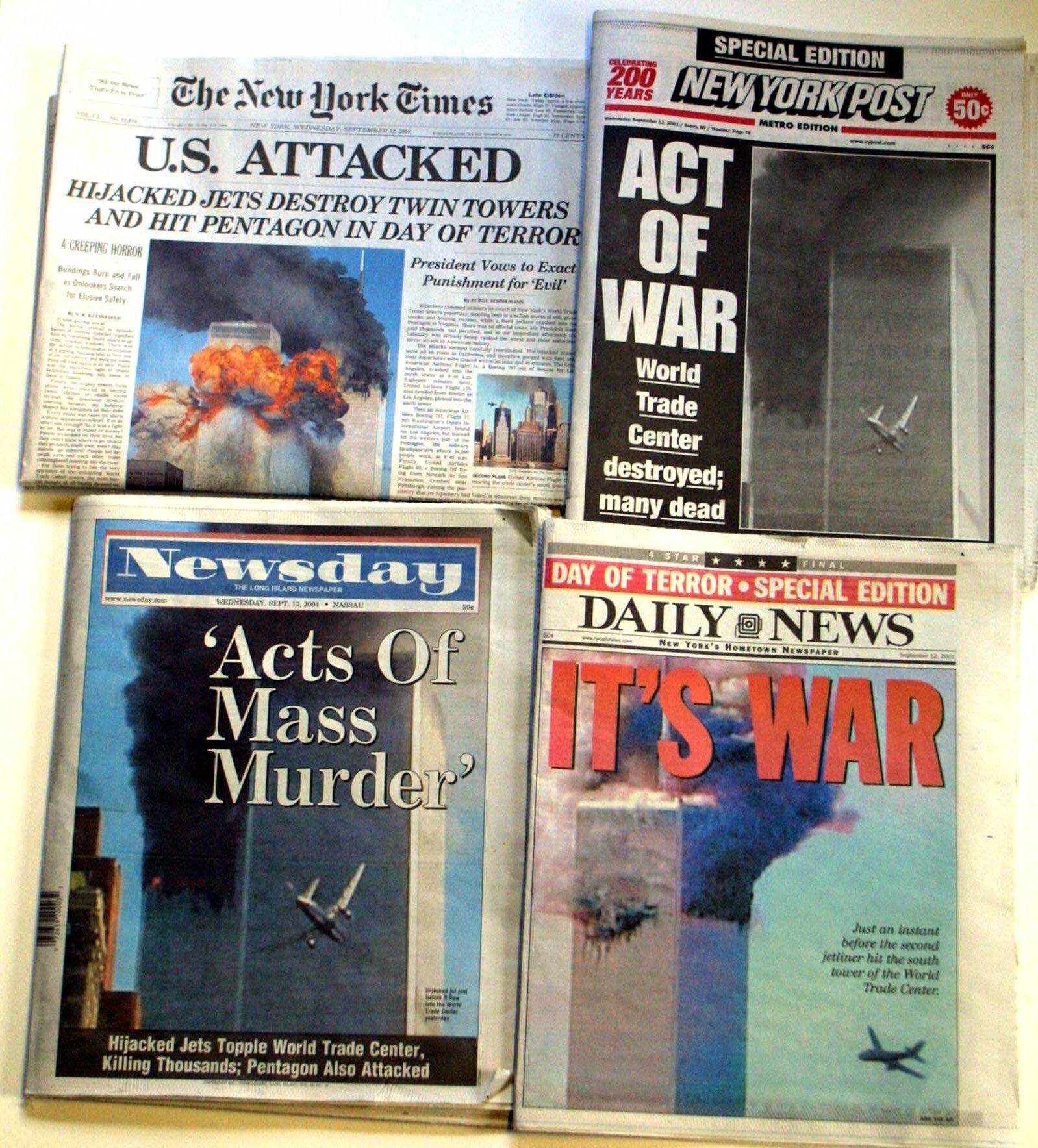 The New York newspapers Wednesday, Sept. 12, 2001, show coverage of the terrorist attack on the World Trade Center. (AP Photo/Diane Bondareff)