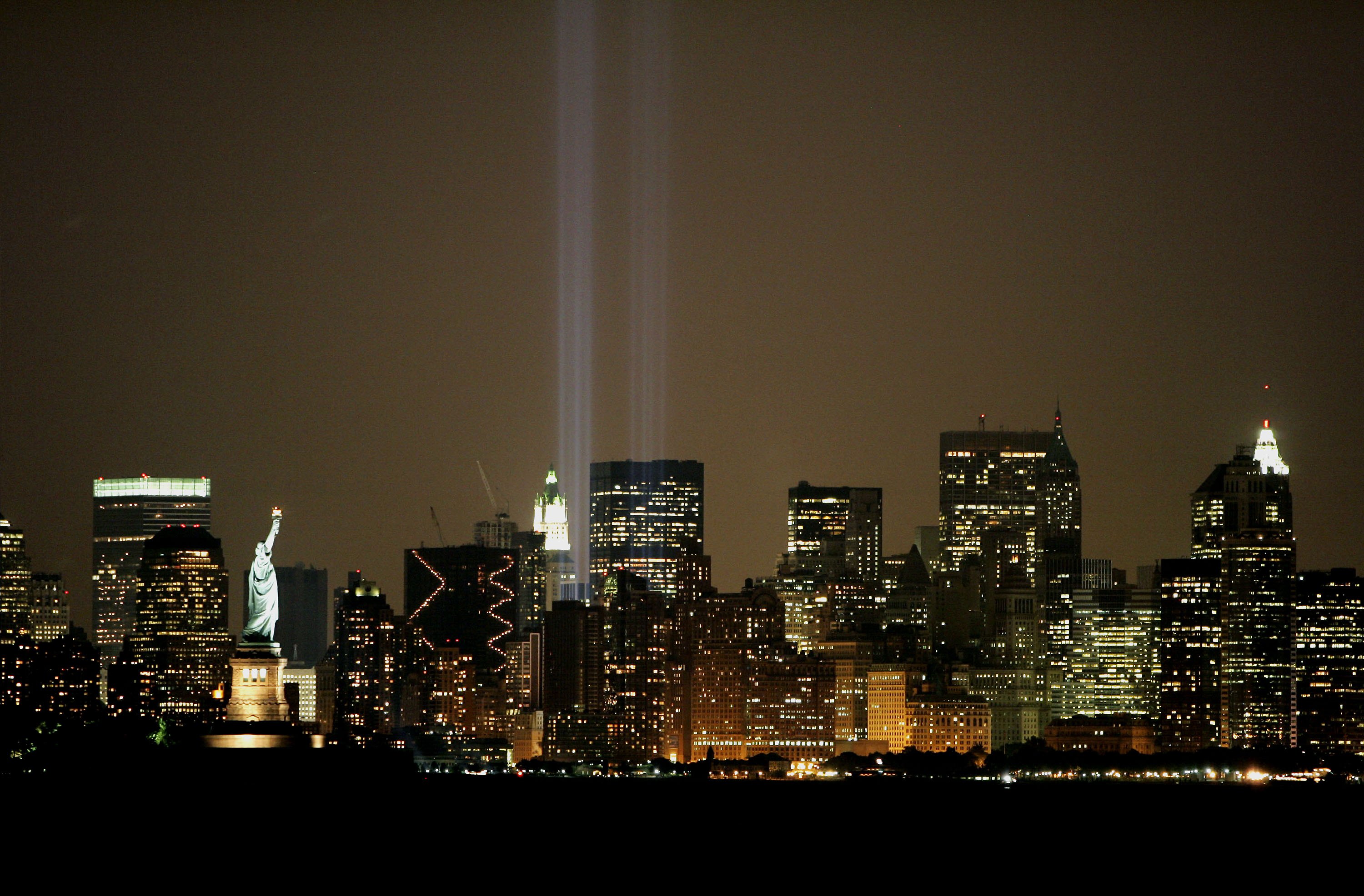 NEW YORK - SEPTEMBER 8: The "Tribute in Light" memorial as seen from Bayonne, New Jersey, consists of two shafts of light to represent the World Trade Center Twin Towers, is tested before the fifth anniversary of 9/11 terrorist attacks September 8, 2006 in New York City. (Photo by Sylwia Kapuscinski/Getty Images)