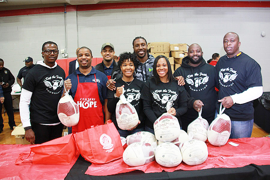 Atlanta Falcons' wide receiver Roddy White, center, with his Keep the Faith Foundation members (Photos by Terry Shropshire for Atlanta Daily World and Real Times Media). 