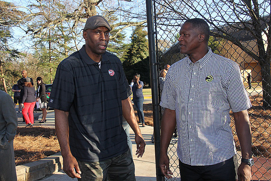 Local luminaries Kevin Willis, left, and Dominique Wilkins were on hand to bestow their blessings on the new court for the Center of Hope. 