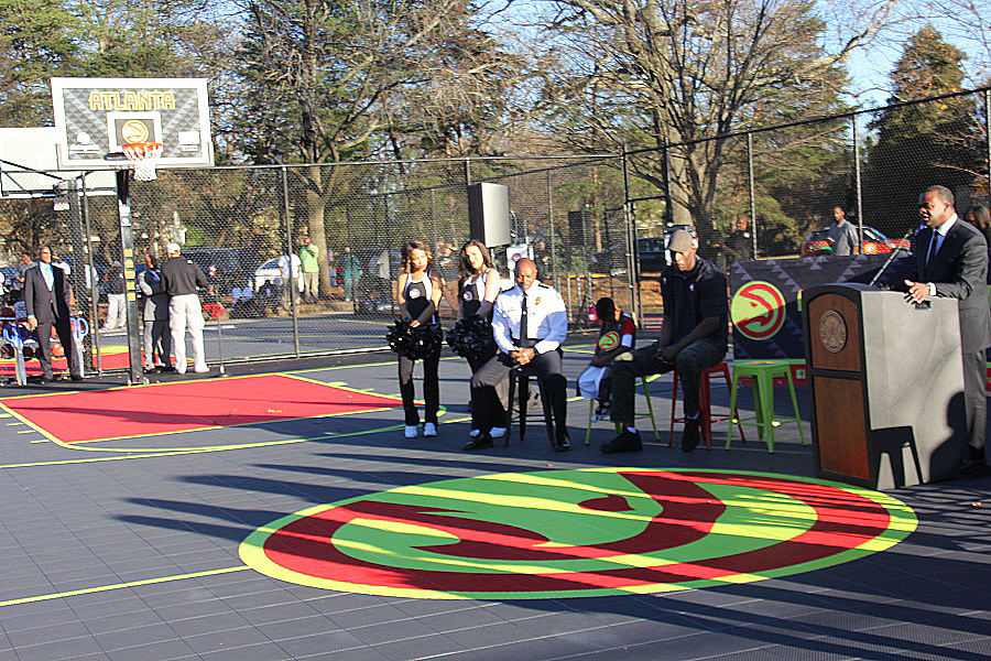 Mayor Kasim Reed christens the spectacular new Atlanta Hawks court at Grant Park (Photos by Terry Shropshire for Atlanta Daily World and Real Times Media). 