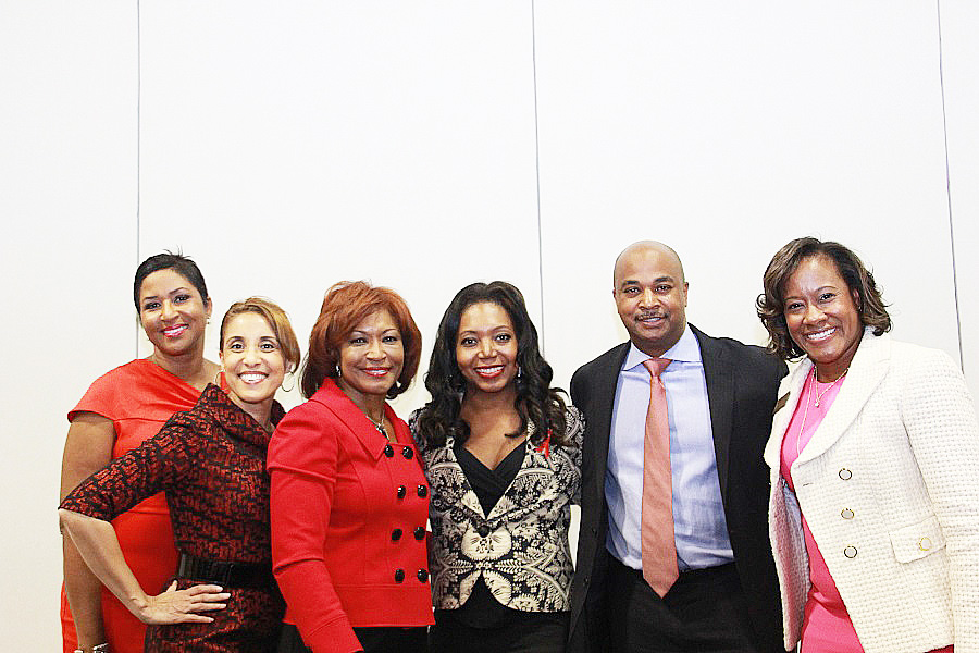 Scarlett Pressly-Brown, center in red, along with Councilman Kwanza Hall and other members of SCLC Women, Inc. 
