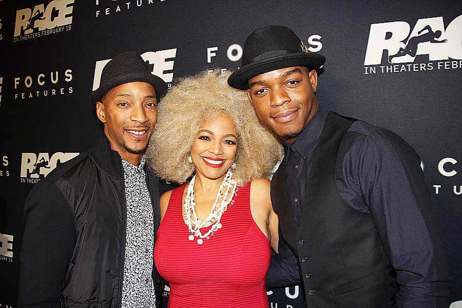Kim Fields is sandwiched by her husband Christopher Morgan, left, and "Race" star Stephan James. 