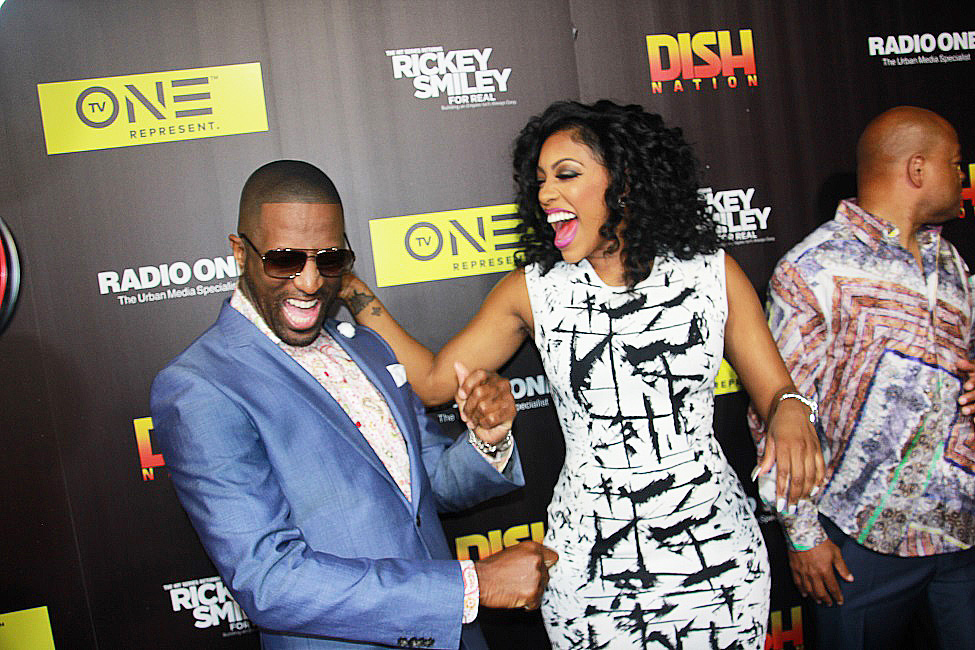Rickey Smiley and Porsha Williams break out with spontaneous dance after greeting on the red carpet premiere (Photos by Terry Shropshire for Real Times Media and Atlanta Daily World). 