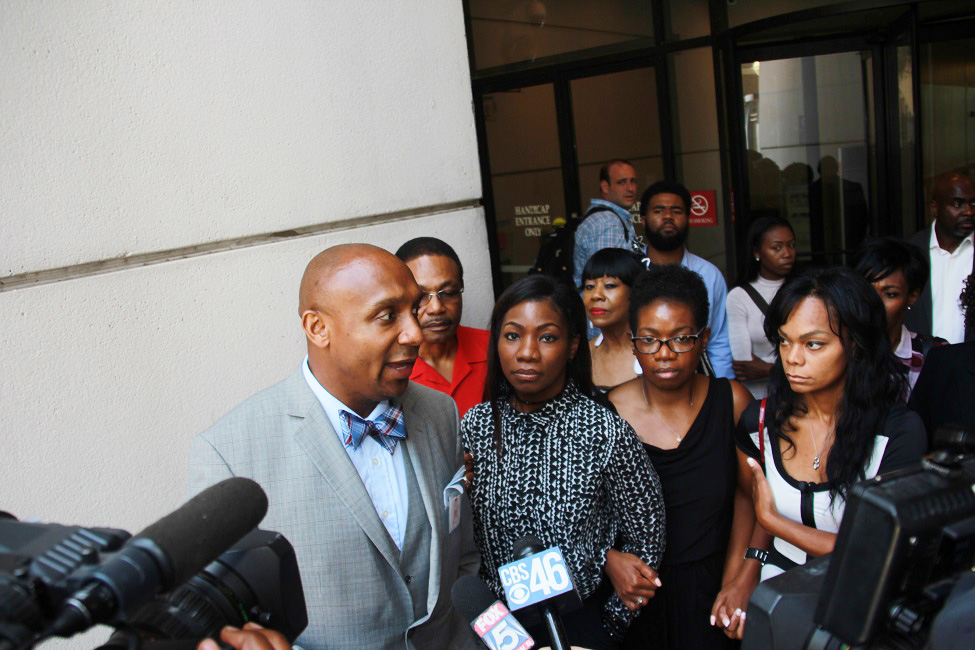 Attorney Mawuli Mel Davis, left, addresses the media as Jamarion Robinson's mother stands next to him (Photos by Terry Shropshire for Atlanta Daily World and Real Times Media). 