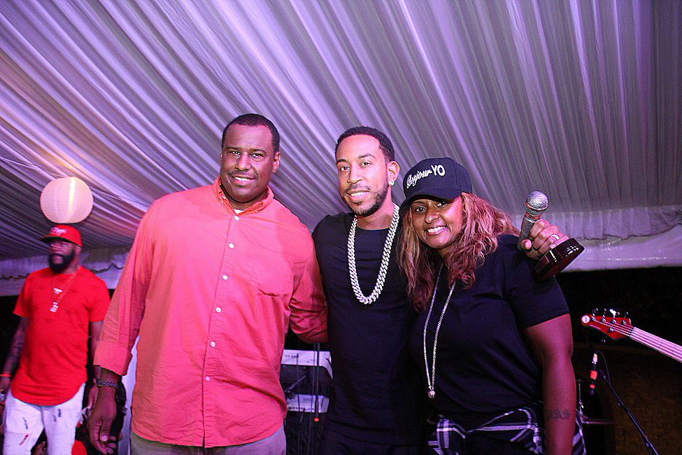 Ludacris, center was honored by the ATL Live in the Park co-creators Marlon Nichols, left, and Shanti Das, right. Event host Ed Lover is in the red (Photos by Terry Shropshire for Atlanta Daily World and Real Times Media).