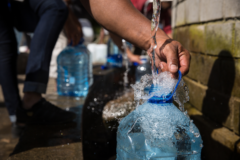 Collecting,Natural,Spring,Water,With,5,Litre,Plastic,Water,Bottle